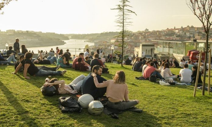 People enjoying warm spring evening in Porto